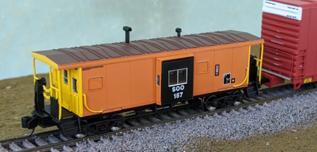 Bluford Shops 44271 International Car Bay Window Caboose Phase 4 - Ready to Run -- Soo Line 157 (Ex-MILW, orange, black, yellow), N Scale