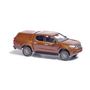 Busch HO 53706 2015 Nissan Navara/Frontier Crew-Cab Pickup Truck with Cap, Brown