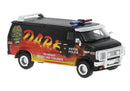 PREORDER Brekina HO 18258 GMC Verdura Cargo Van, Assembled, D.A.R.E. Police (black, orange flames)