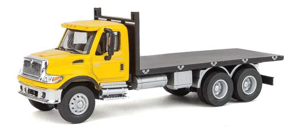 Walthers SceneMaster 949-11653 International(R) 7600 3-Axle Flatbed Truck - Assembled -- Yellow Cab, Black Flatbed, HO Scale